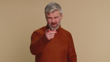 Middle-aged man pointing at camera and showing stupid gesture, blaming some idiot for insane plan video