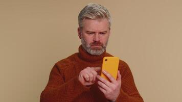 Man use smartphone typing browsing, loses becoming surprised sudden lottery results, bad fortune video
