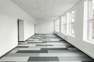 Empty office space With Checkered Floor and Windows photo