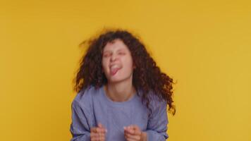 Funny joyful woman making playful silly facial expressions, grimacing, fooling around showing tongue video