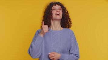 Cheerful young woman greatly approves your suggestion, shaking head approvely like proposal, yes video