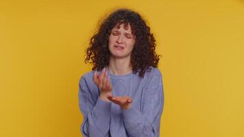 Upset disappointed woman wipes tears and cries from despair, being sad because of unfair things loss video