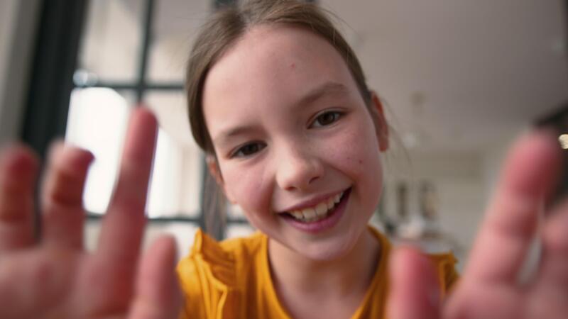 Webcam POV carefree joyful smiling Caucasian schoolgirl girl ...