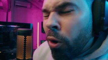 Astonished shocked Caucasian vlogger guy male laugh blogger influencer close up surprised man gaming addicted male streamer play cyber sport online game pc computer neon amazement wow emotion at home video