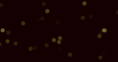 Golden Dust on Black.An abstract background of sparkling golden dust particles scattered against a deep black backdrop, creating a mesmerizing and ethereal effect. video