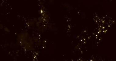 A mesmerizing abstract background of golden dust particles scattered across a deep black canvas, evoking the ethereal beauty of space and the vastness of the universe. video