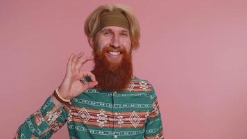 Hippie man looking approvingly showing ok approve feedback gesture like sign positive something good video
