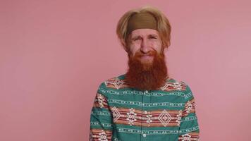 Displeased hippie man reacting to unpleasant awful idea, dissatisfied with bad proposal, no, dislike video