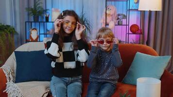 Siblings children girls listening music, dancing disco fooling around having fun, relaxing on party video