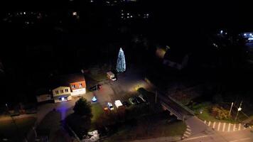 An aerial view of a christmas tree lit up at night video