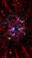 A unique spectacle. A bright purple, violet spiral galaxy consisting of thousands of luminous particles smoothly changes perspective, emitting spectacular waves into space. video
