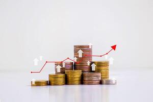 stack of silver coins with trading chart in financial concepts and financial investment business stock growth photo