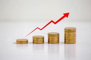 stack of silver coins with trading chart in financial concepts and financial investment business stock growth photo