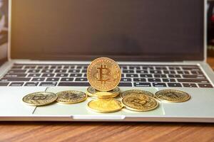 national flag of liberia on the keyboard with bitcoin coins on a grey background.concept photo