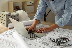 Architect engineer design working on blueprint planning concept photo