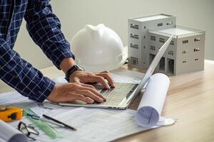Architect engineer design working on blueprint planning concept photo
