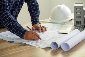 Architect engineer design working on blueprint planning concept photo