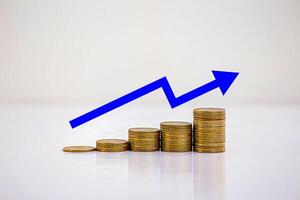 stack of silver coins with trading chart in financial concepts and financial investment business stock growth photo