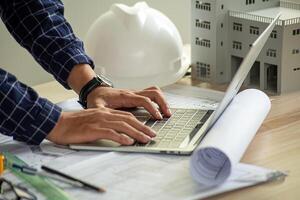 Architect engineer design working on blueprint planning concept photo
