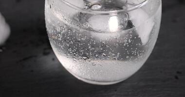 cold carbonated water with a glass of ice photo
