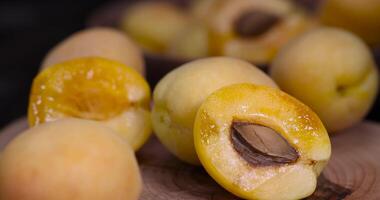 ripe soft apricot fruits on the cutting board photo