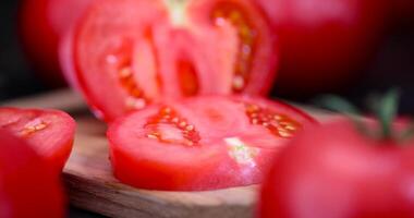 chop ripe red tomatoes on the table photo