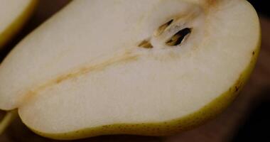 sliced ripe yellow-red pears on the table photo