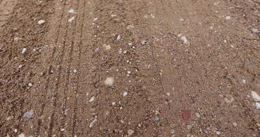 close-up of a part of a wet road without asphalt photo