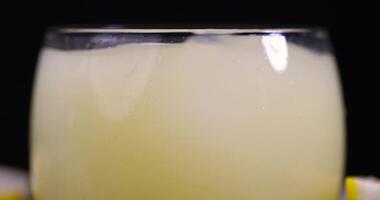 ripe sliced lemon and lemon juice with ice photo