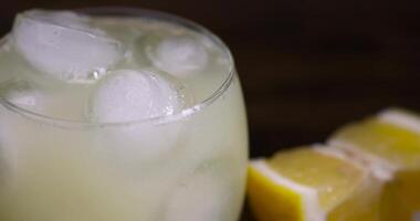 ripe sliced lemon and lemon juice with ice photo