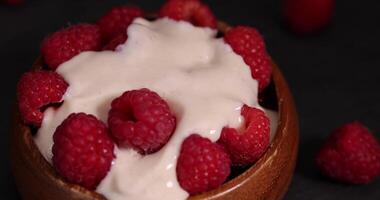 raspberry yogurt on the table close up photo