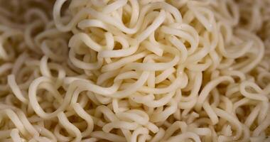 details of flour noodles with eggs during cooking photo