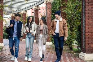 group of four young students enjoying after class photo