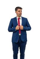 vertical Perplexed Businessman Looking Sideways and Holding Suit white background photo