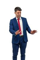 vertical Conflicted Businessman with Rejection Gesture and Contradictory Expression white background photo