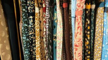 A row of ties with floral patterns photo