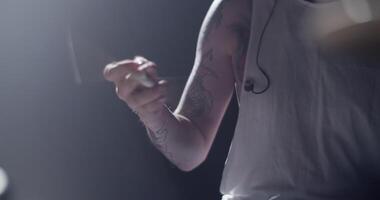 Man with drum kit playing music video