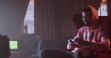 Man playing videogame in hookah lounge bar video