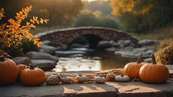 A serene autumn scene with pumpkins by a tranquil stream and stone bridge. photo