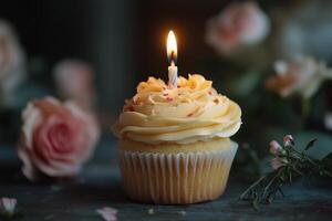 Delightful cupcake with a glowing candle and festive sprinkles for special occasions photo