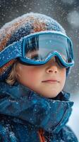 Excited child enjoying snowy winter day in mountains with ski gear photo