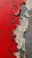 Textured wall with red, white, and gray paint peeling in artistic patterns photo