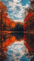 Vibrant autumn colors reflect on calm lake surface in serene forest setting photo