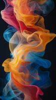 Colorful swirling smoke patterns create a dynamic visual display in abstract artwork photo