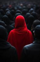 Bright red scarf stands out in a crowd of black-clad individuals during a solemn gathering photo