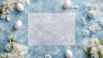 Spring floral arrangement featuring blank paper, eggs, and a bee on a blue background photo