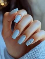 Elegant ombre manicure with sparkling accents on well-groomed nails photo