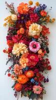 Colorful floral arrangement on a textured wall showcasing various blooms in bright shades photo
