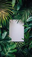 Creative blank canvas surrounded by lush tropical leaves in a serene setting photo