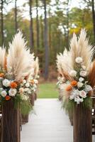 Beautiful floral arch adorned with pampas grass and flowers in a serene forest setting photo